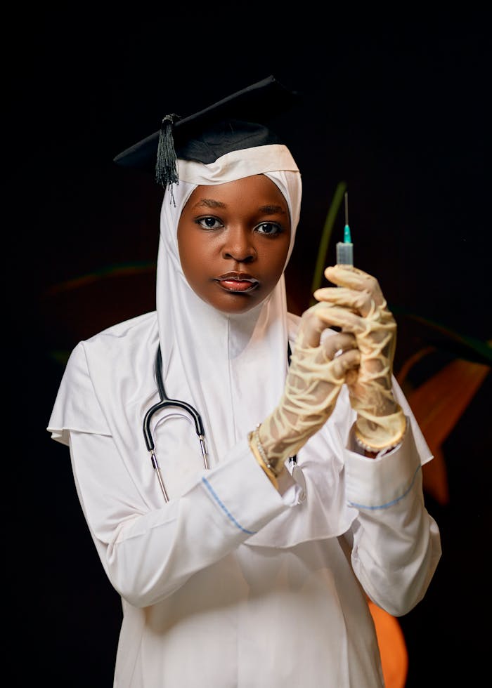 Young female doctor in hijab prepares injection with professionalism.